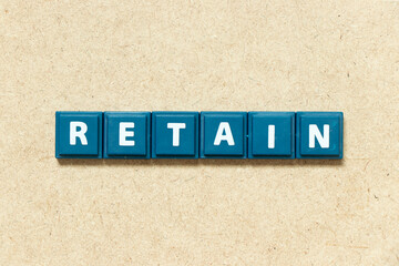 Obraz premium Tile alphabet letter in word retain on wood background