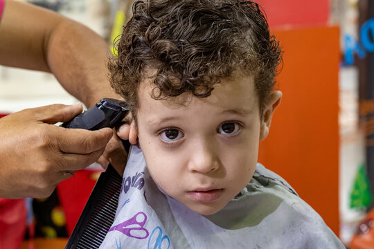 photo of beautiful boy in hairdressing salon