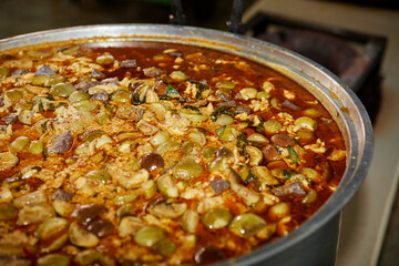 Green curry chicken intense soup in cooking pot