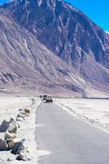 mountain road at Ladakh India with view of the Himalayan mountain range.