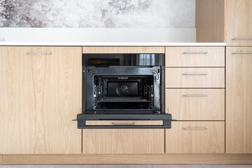 Modern oven with open door built in kitchen furniture