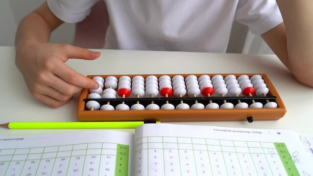 The boy is engaged in abacus, mental arithmetic for children