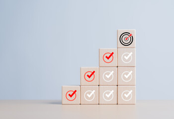 Checklist, Complete Task list. Goals achievement or enterprise objective target for company success. To do list. Check mark and dartboard from top of wooden cube stacks. Keys for success in business.