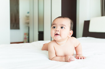 Baby smile, Little Boy lying on the bed, small child wandering.