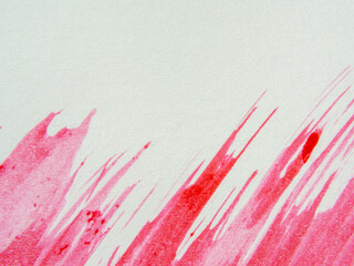 Red watercolor splashed on white paper. Copy space above