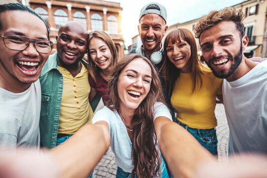 Multiracial best friends taking selfie pic with smart mobile phone outside - Group of young people having fun on summer vacation - Friendship concept with guys and girls hanging out together