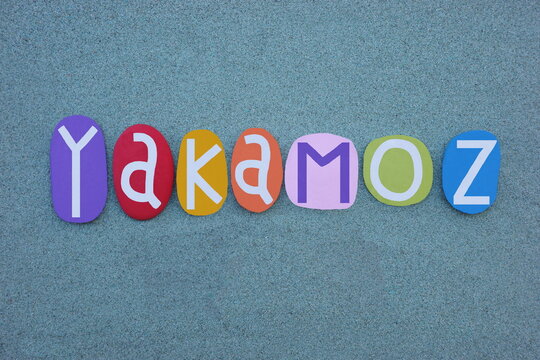 Yakamoz, turkish word meaning, the reflection of  moonlight on water, composed with multi colored stone letters over green sand