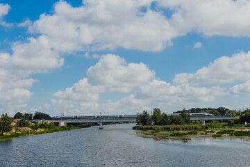 An express train travels across the river. Poland