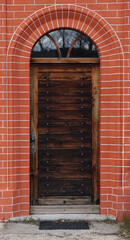 wooden door in brick house