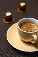 Espresso coffee cup with capsules