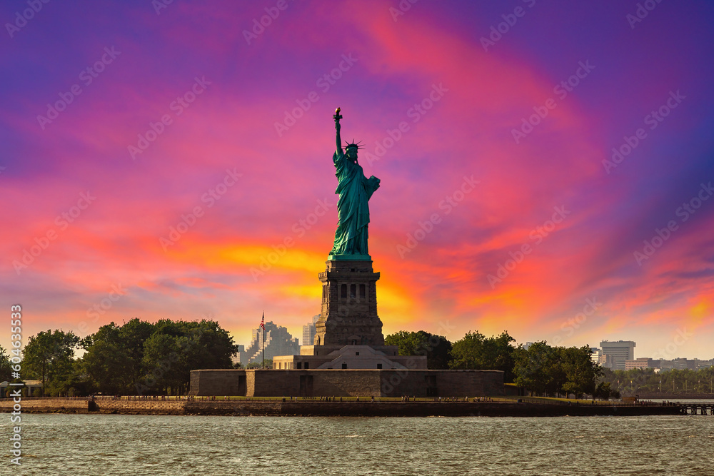 Poster statue of liberty at sunset