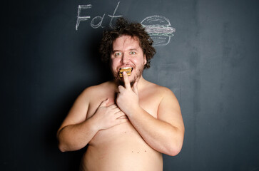 Diet and healthy lifestyle. Funny fat man eating a burger.	