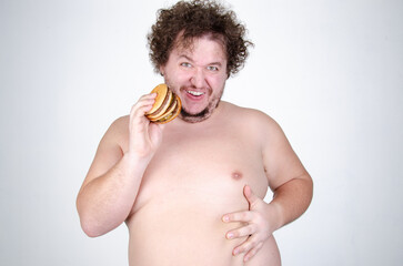 Diet and healthy lifestyle. Funny fat man eating a burger.	