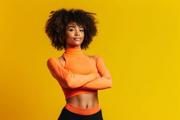 With confidence and power, a young black fitness woman strikes a pose on a vibrant yellow background. Ai generated.
