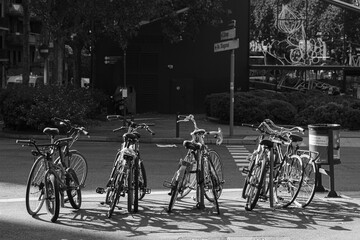 BARCELONA, SPAIN - JULY 22, 2022: Black and white photo of a parking for bicycles in one of the streets of the city.