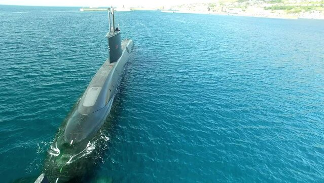 Army, drone and travel with submarine in ocean for transportation, war and underwater technology. Military, metal and cruise with marine boat vessel sailing in sea for naval, armed forces and stealth
