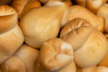 Smoked pickled cheese on the market.