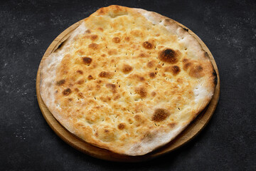 baked jewish matzo bread on wooden board