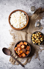 Fried Paneer with bowl of rice and eggplants
