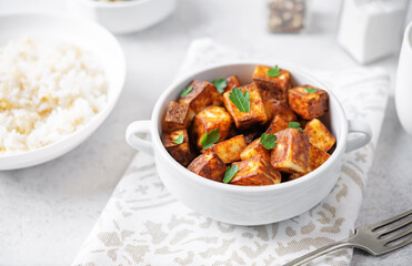 Fried Paneer with bowl of rice and eggplants