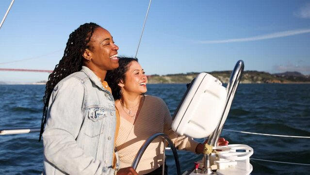 Diverse Lesbian Gay girlfriends sunset sailing San Francisco