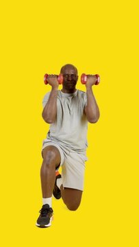 African strong man doing dumbbell Arnold press