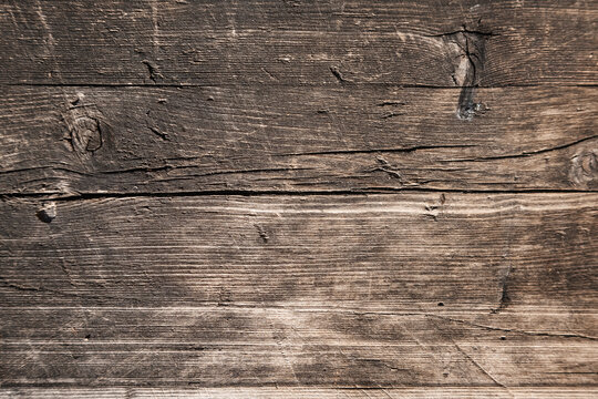 Background image: old board with cracks, knots and rough surface, wood texture