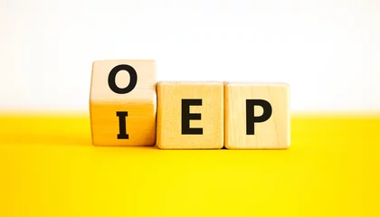 Deurstickers IEP or OEP symbol. Concept words IEP initial enrollment period OEP open enrollment period. Beautiful yellow table white background. Medical initial or open enrollment period concept. Copy space. © Dzmitry