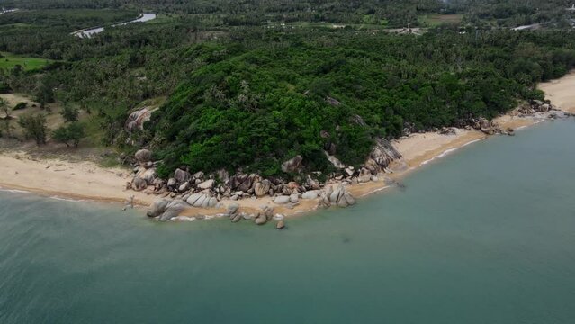 aerial view of Tropical island rock on the beach with blue sky and green tree, Kha kha beach Pattani thailand