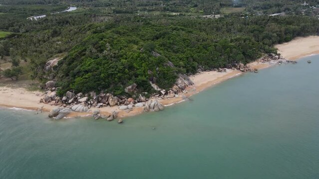 aerial view of Tropical island rock on the beach with blue sky and green tree, Kha kha beach Pattani thailand