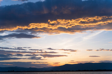 Fototapeta na wymiar Dramatic clouds during sunrise over the mountains, Albanian landscape