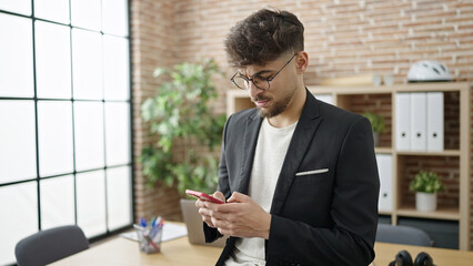 Young arab man business worker using smartphone at office