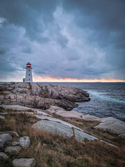 Lighthouse on rocky shore at Peggy's Cove