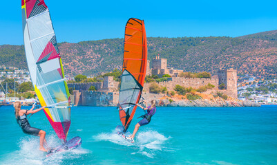 Windsurfer Surfing Wind On Waves - Saint Peter Castle (Bodrum castle) and marina in Bodrum, Turkey
