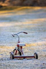 Tricycle left out in the snow
