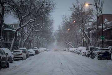 MONTREAL, CANADA - DECEMBER 29, 2016: Typical North American residential  street covered in snow in a residential suburban part of Montreal, Quebec, Canada