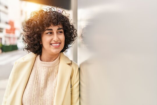 Young Middle East Woman Excutive Smiling Confident Looking To The Side At Street