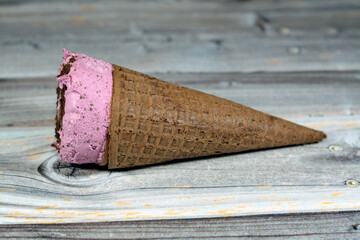 Ice-cream of special flavors in crispy wafer cones, melting cold ice cream twirl in a wafer...