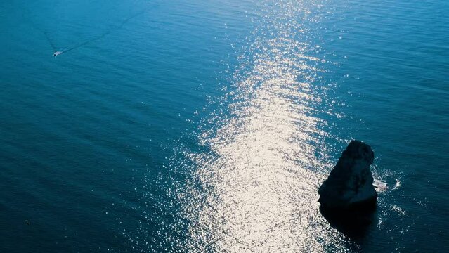 Beautiful seascape. Blue sea or ocean with rocks on a sunny day. 4K