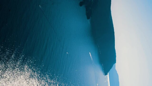 Beautiful seascape. Blue sea or ocean with rocks on a sunny day. 4K