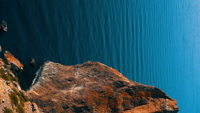 Beautiful seascape. Blue sea or ocean with rocks on a sunny day. 4K