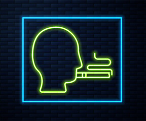 Glowing neon line Man smoking a cigarette icon isolated on brick wall background. Tobacco sign. Vector