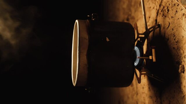 Camping boiler for heating water on a gas burner. 4K