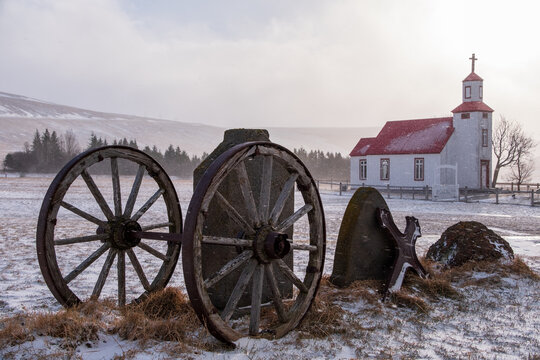 Abandoned wagon in front of  Bolstadharhlidh church in Svartardalur valley, Hunavatnshrepp, Iceland