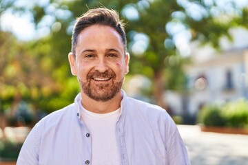 Young caucasian man smiling confident standing at park