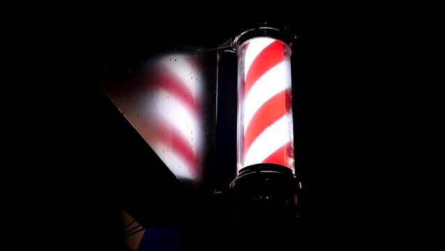 Barber Shop Pole at Night with Reflection