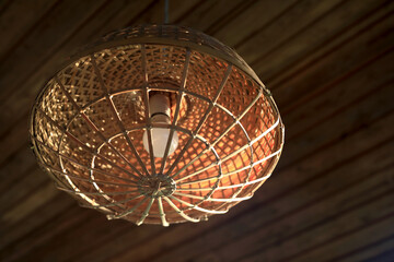 Wooden vintage lampshade on ceiling