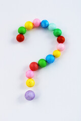 Question mark formed with colored spheres