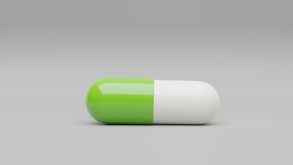 Green white capsule pill on a white background - Medicine healthcare medicaments