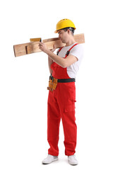 Young carpenter with wooden planks and ruler on white background